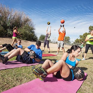 Group of mature adults working out in fitness class